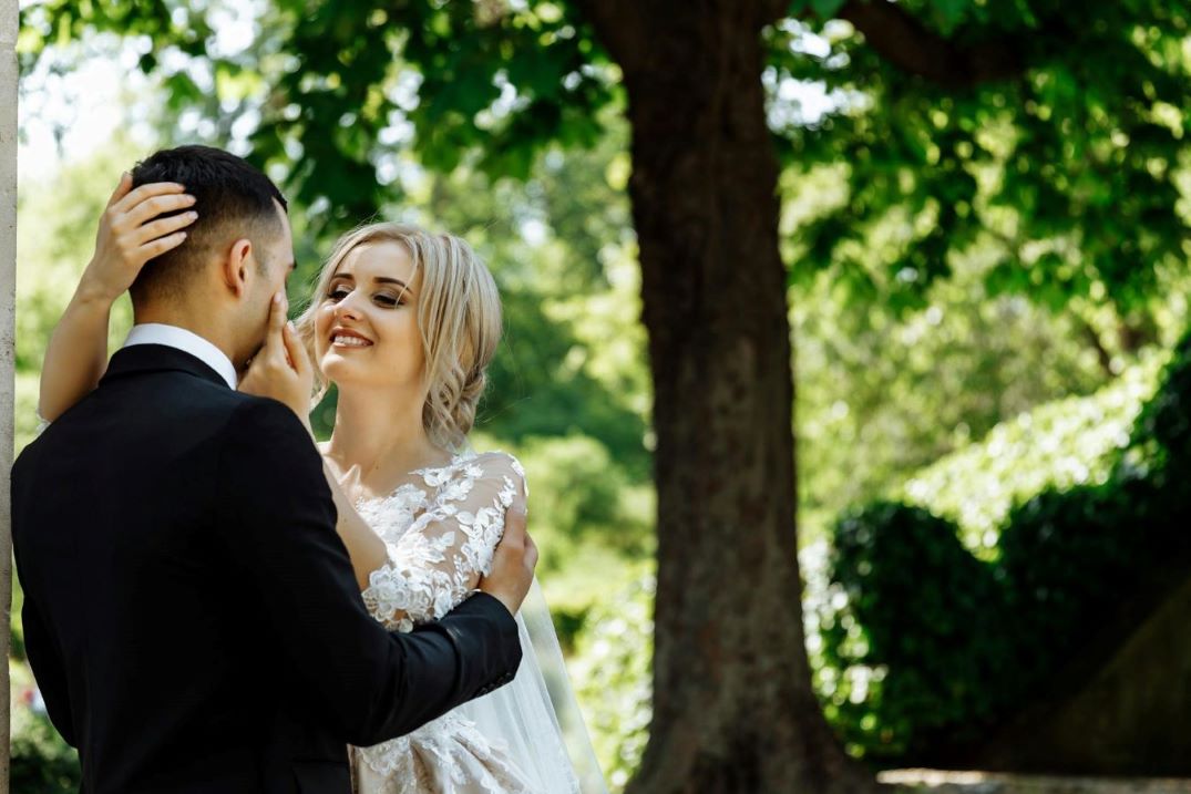 A newlywed couple standing together.